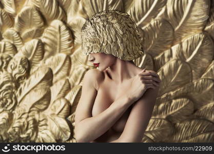 Conceptual portrait of a seductive woman wearing feather hat