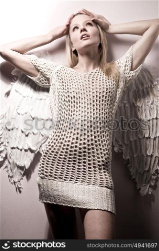 Conceptual portrait of a young angel - woman