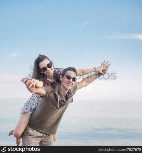Conceptual portrait of a young, cheerful married couple on vacation