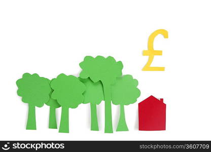 Conceptual shot of trees, residential house with a pound sign over white background