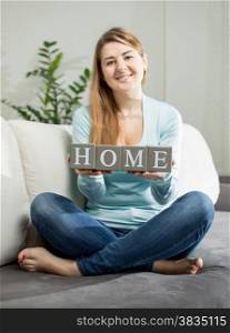 Conceptual shot of woman holding word