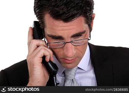 Concerned businessman on the telephone