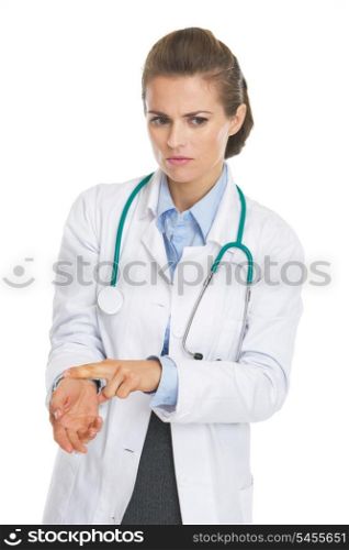 Concerned doctor woman checking pulse