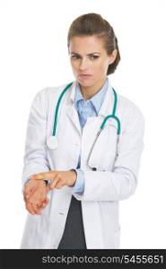 Concerned doctor woman checking pulse