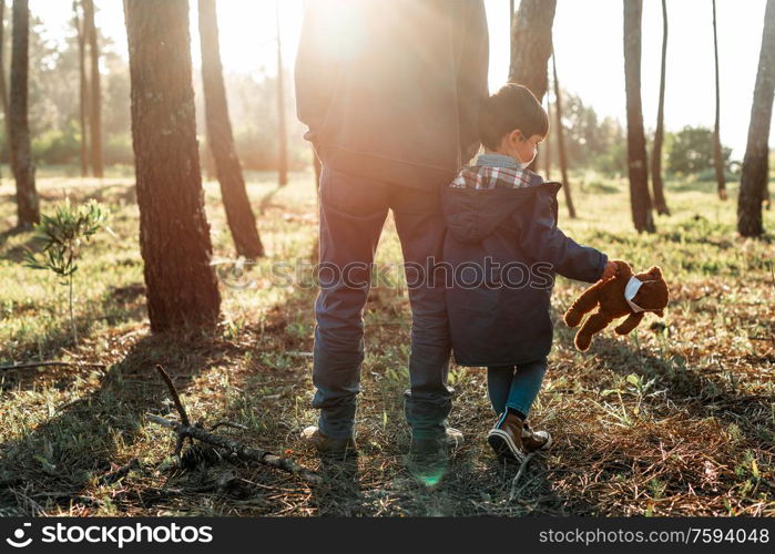 Concerned father and son using air protection masks