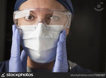 Concerned Female Doctor or Nurse Putting on Protective Facial Wear.