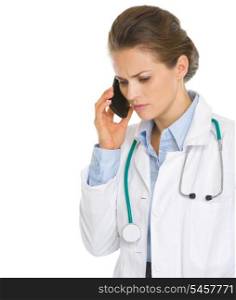 Concerned medical doctor woman speaking mobile phone