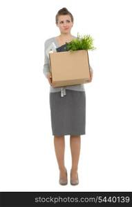 Concerned woman employee holding box with personal items