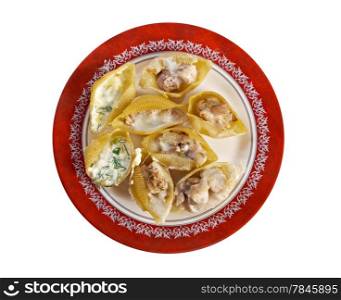 Conchiglioni rigati stuffed chicken and cheese. isolated on white background.