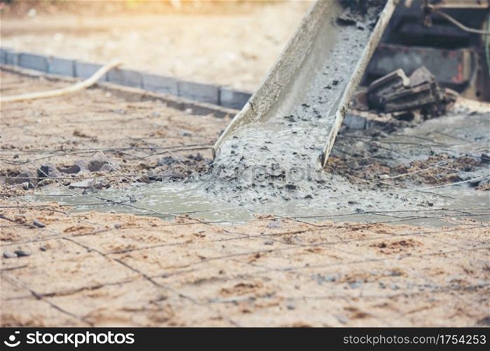 Concrete cement pouring during commercial concreting floors of building