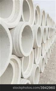 Concrete drainage pipes for industrial building construction.