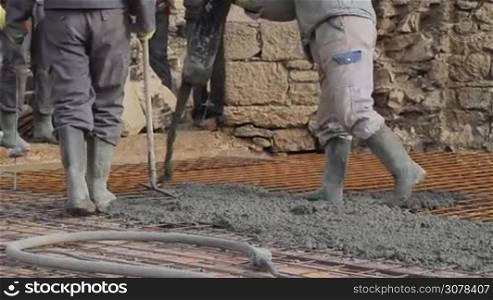 Concrete pouring works, compacting liquid cement