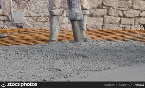 Concrete pouring works, compacting liquid cement