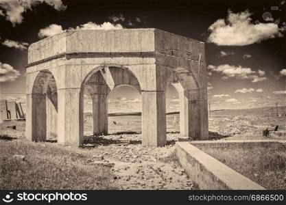 concrete ruins of one of five reduction plants and pump stations manufacturing potash during World War I near Antioch, Nebraska, sepia toned image