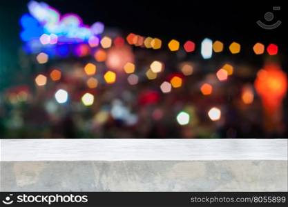 Concrete table top with abstract blurred lights, stock photo