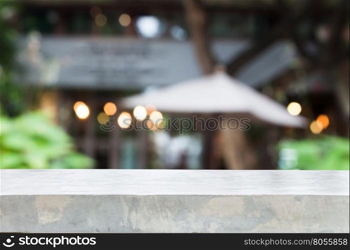 Concrete table top with cafe blurred abstract background