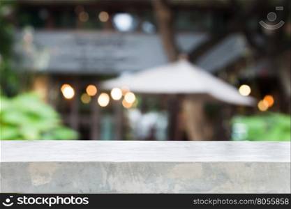 Concrete table top with cafe blurred abstract background