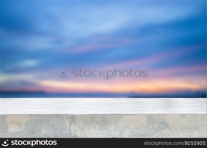Concrete table top with sunset abstract blur background, stock photo