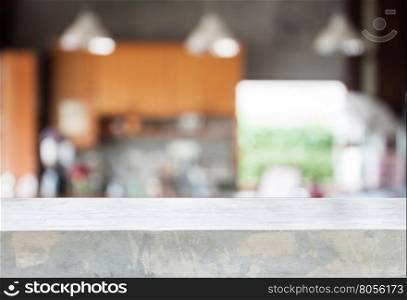 Concrete tabletop with abstract blur coffee shop background