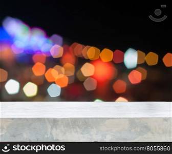 Concrete tabletop with abstract blurred lights, stock photo