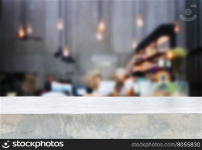 Concrete tabletop with blurred background in coffee shop