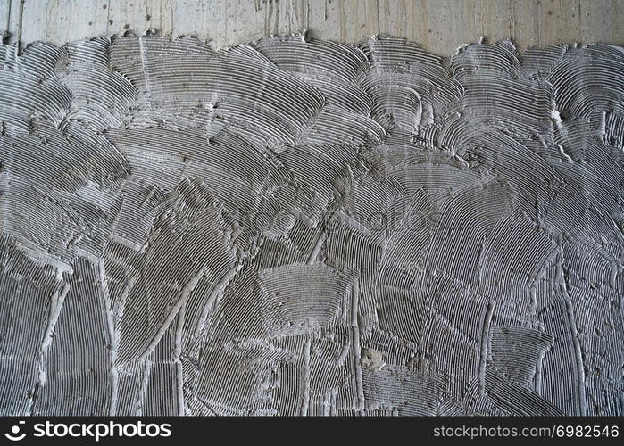 concrete wall comb surface prepared for tiling