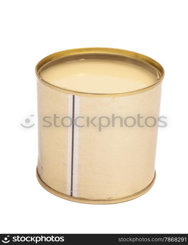 Condensed milk in tin can over white background