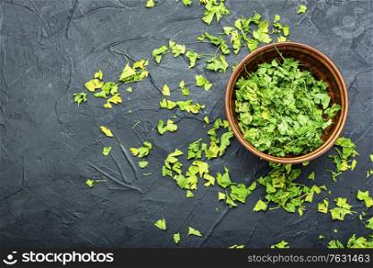 Condiment or spice made from dried green parsley.Copy space. Dried parsley seasoning