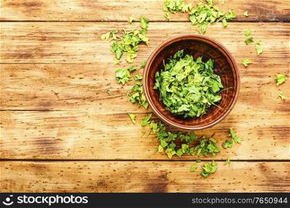 Condiment or spice made from dried green parsley.Copy space. Dried parsley spice