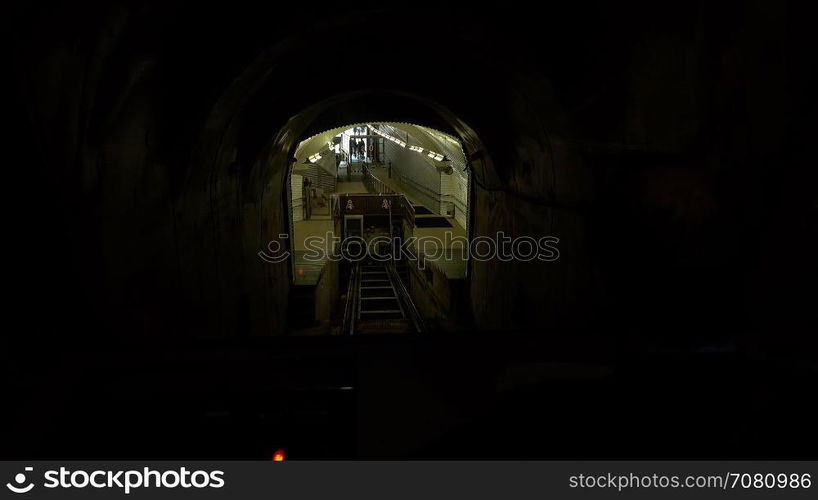 Conductor bringsa Funicular car into the station