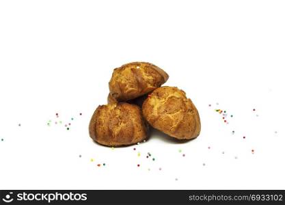Confectionery products and colored powder lie on a white background