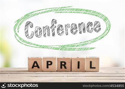 Conference in april launch sign made of wooden cubes