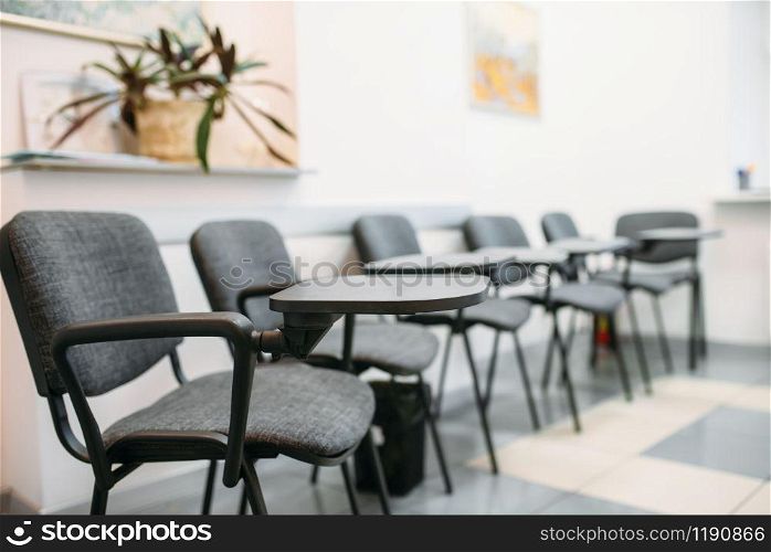 Conference room in business office, nobody. Waiting area in company, chairs with desk
