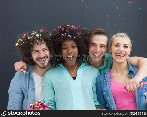 confetti party Multiethnics group of happy young people celebrating new year eve while dancing and have fun at home isolated over gray background