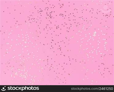 Confetti stars sparkling on pink background.. Confetti stars sparkling on a pink background.