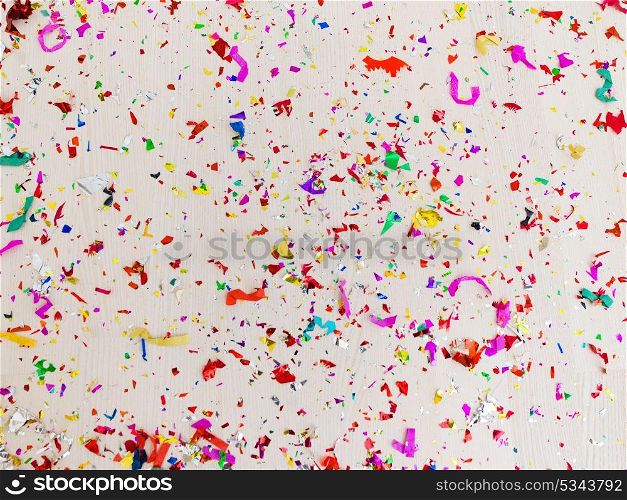 Confetti with wooden floor in the background