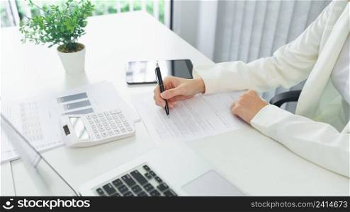 Confidence woman concept, Businesswoman analyzing strategy of business and writing data on document. 