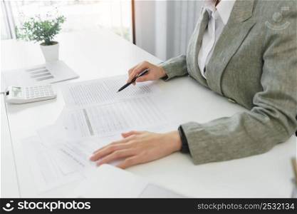 Confidence woman concept, Businesswoman is checking information to analyzing business strategy.