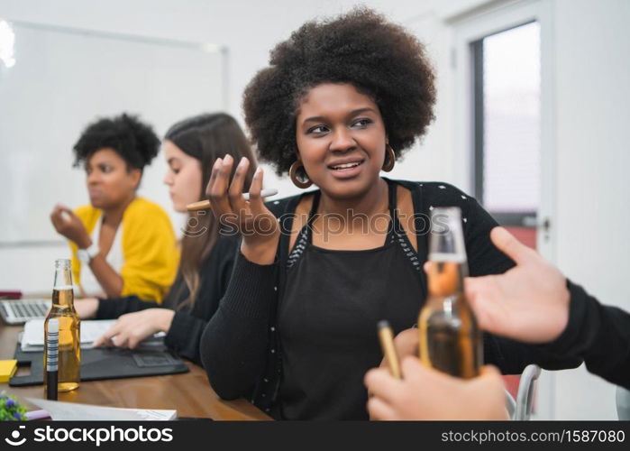 Confident Afro american business woman talking with a partner in the office. Business concept.