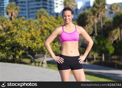 Confident and fit hispanic girl in a sports bra