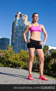 Confident and fit hispanic woman in a sports bra