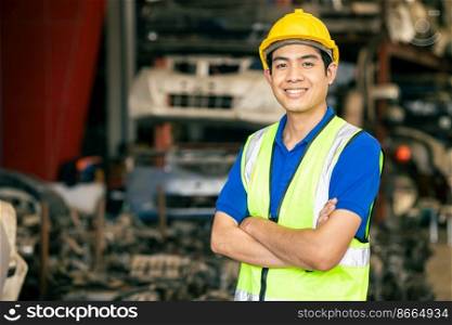 confident Asian male engineer worker standing arm crossed happy smile for enjoy working in factory