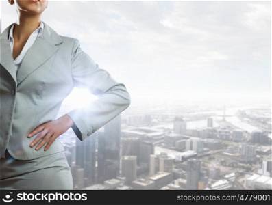 Confident business woman. Close view of businesswoman on modern city background