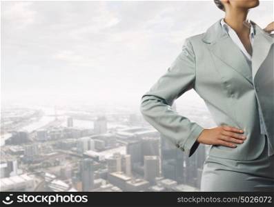 Confident business woman. Close view of businesswoman on modern city background