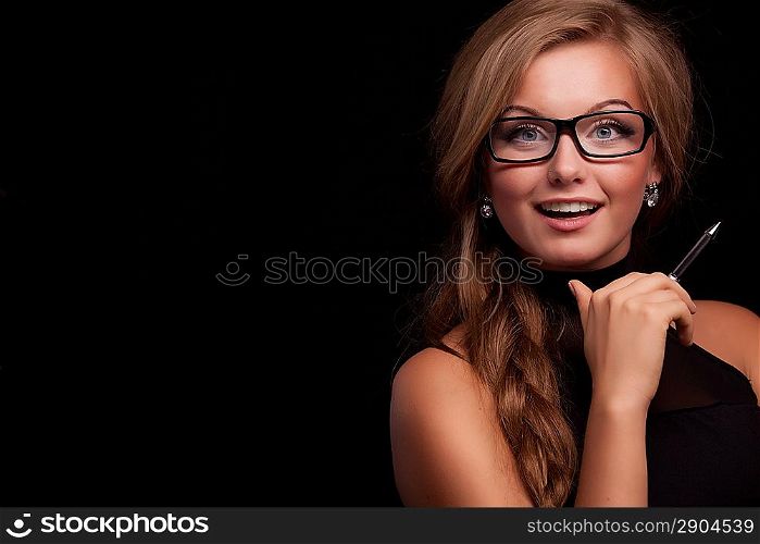 Confident business woman with pen and amazing smile, look at camera isolated on black