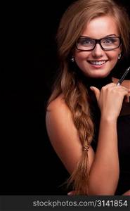 Confident business woman with pen and amazing smile, look at camera isolated on black