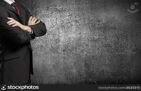 Confident businessman. Chest view of businessman with arms crossed on chest