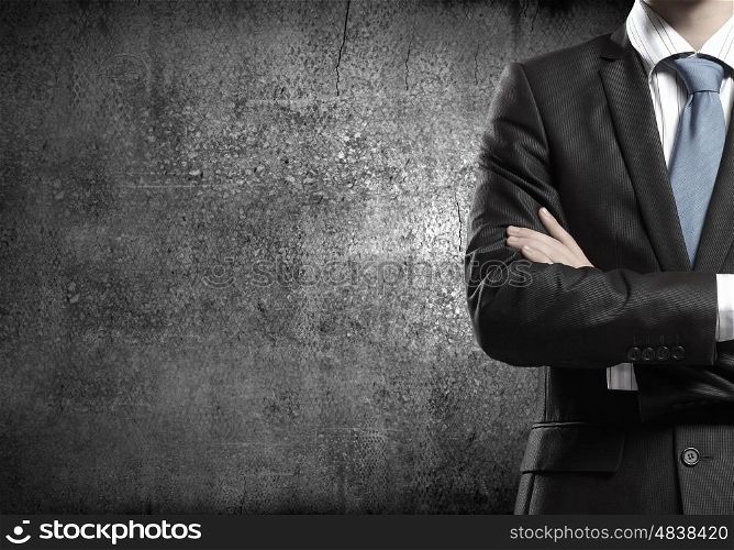 Confident businessman. Chest view of businessman with arms crossed on chest