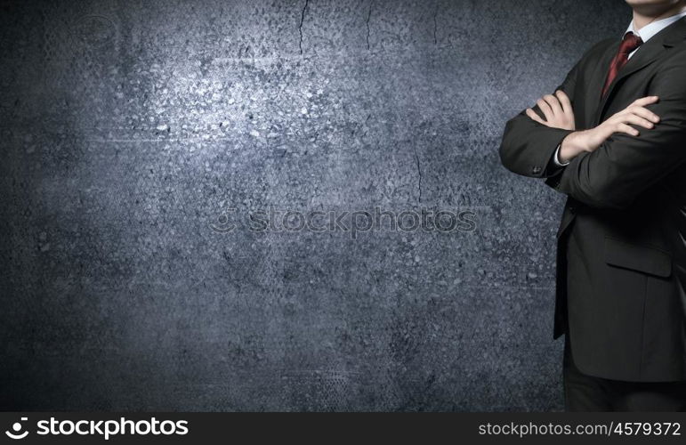 Confident businessman. Close up of businessman with arms crossed on chest