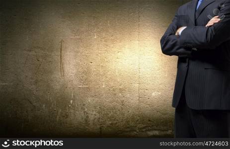 Confident businessman. Close up of businessman with arms crossed on chest